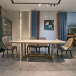 Cream White High-Gloss Dining Table with Rounded Corners and Architectural Gold Metal Bas
